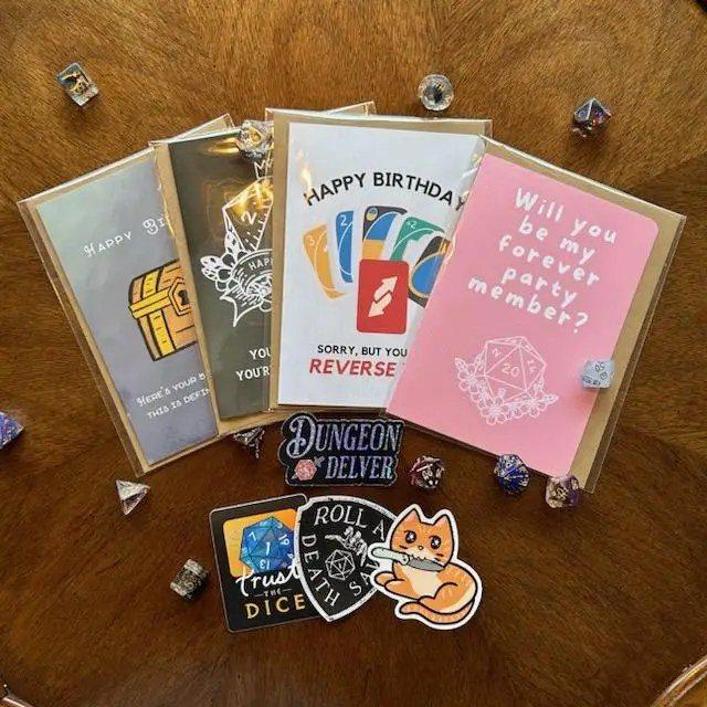 Minva cards, pins and stickers on a shelf at Moon Rabbit Collective